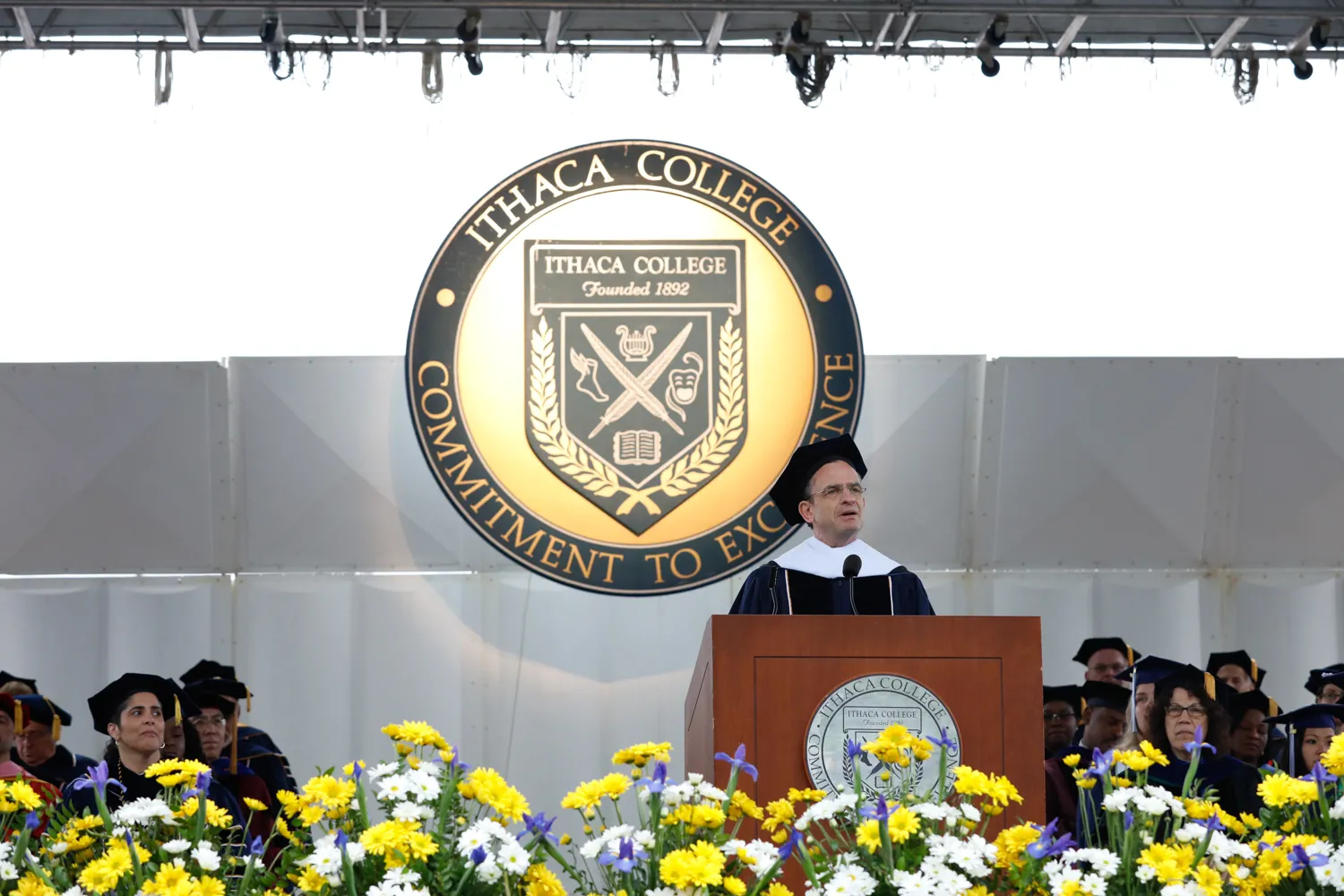 Daniel Weiss speaking at a podium