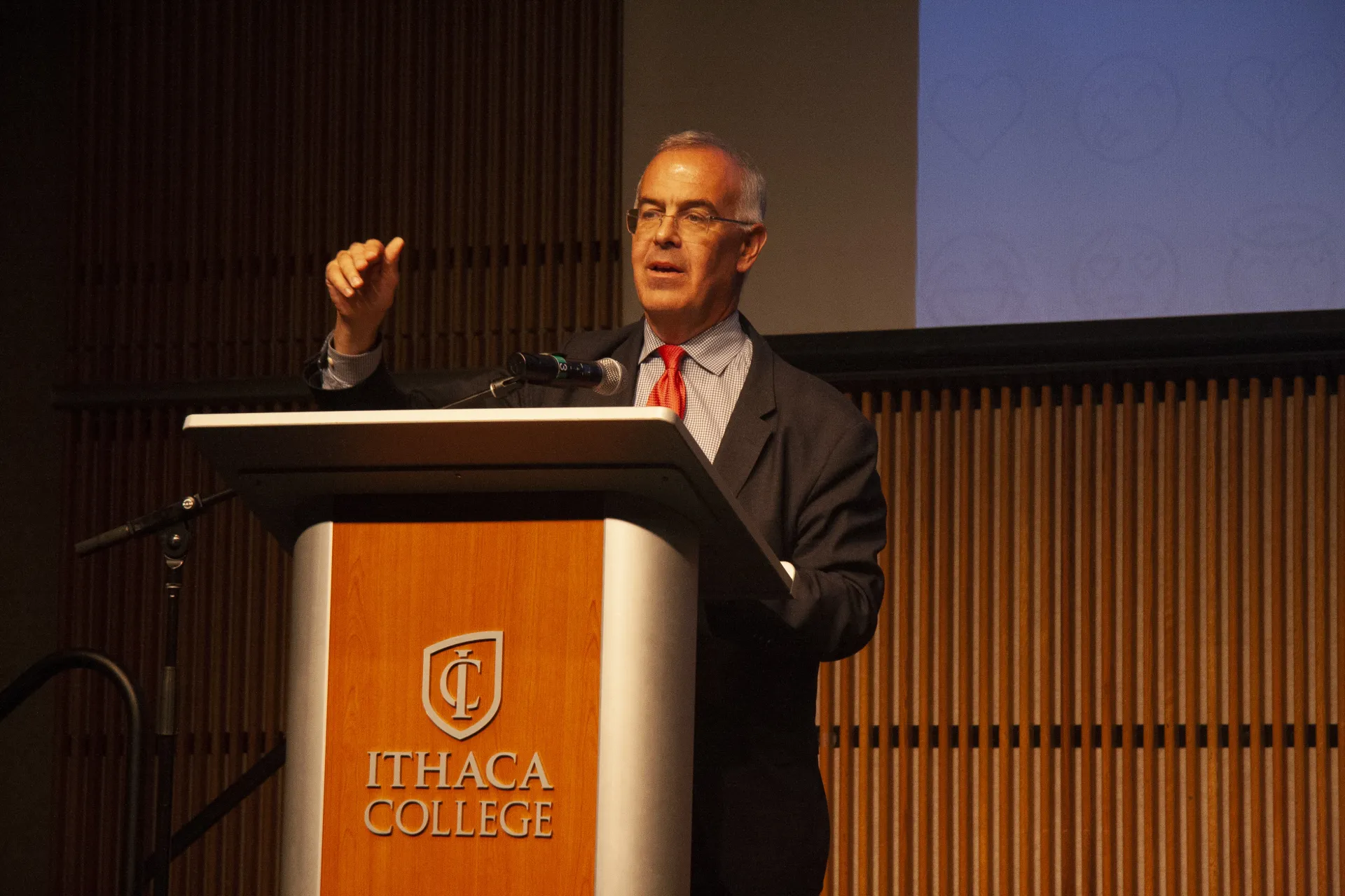 A man speaking at a podium