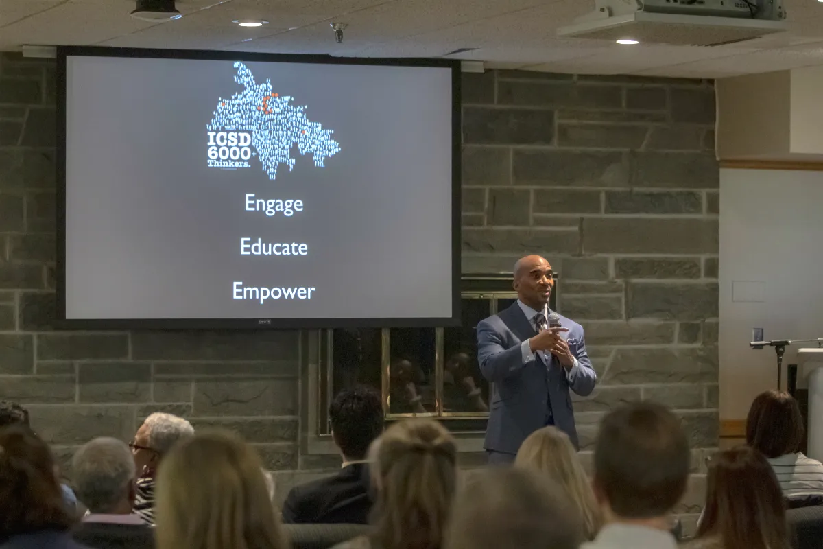 A man gives a presentation to a group of people