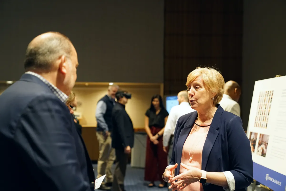 A man and woman speaking to one another