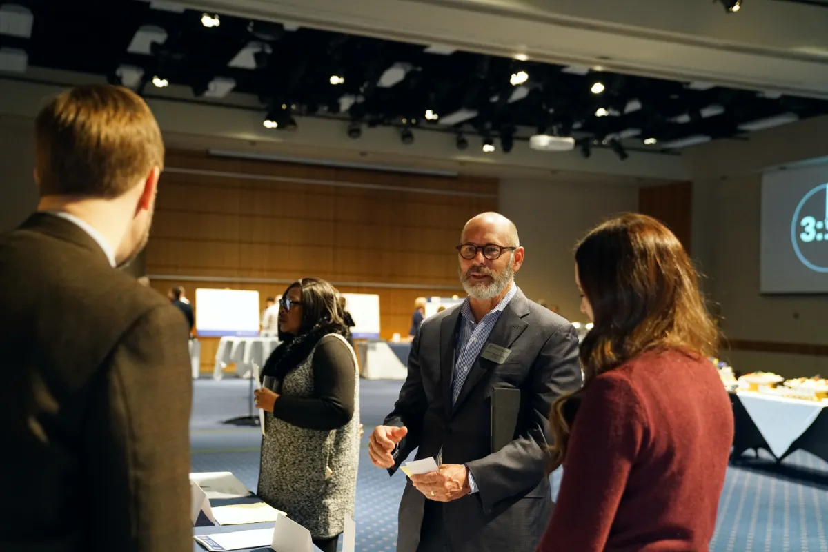 A group of people speaking to each other