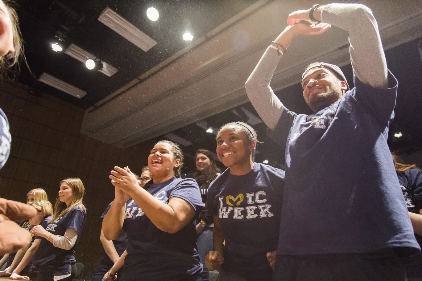 Young people clapping and cheering