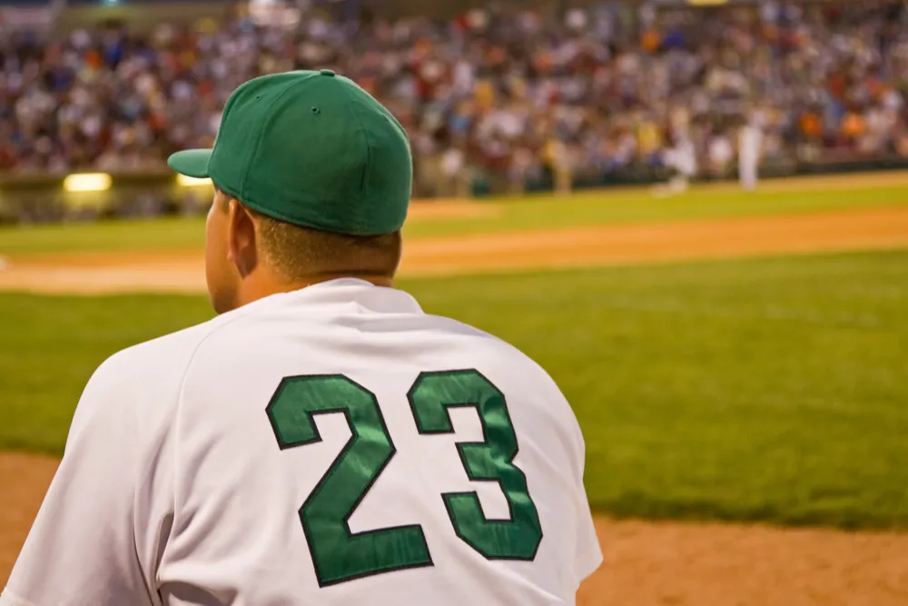 minor league baseball player looks across the field