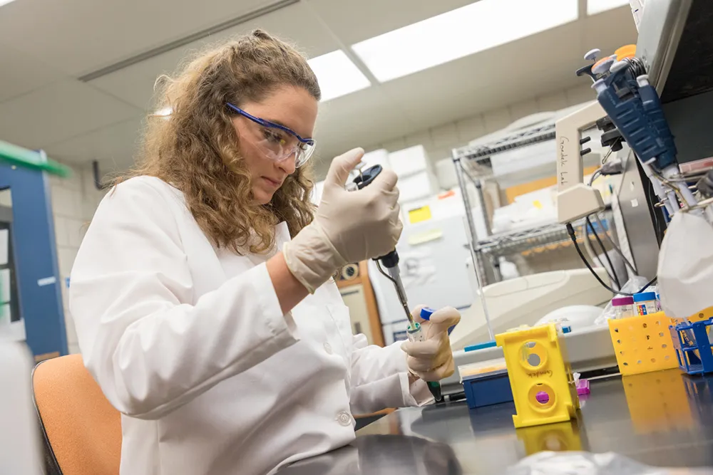 woman with a pipet in the lab