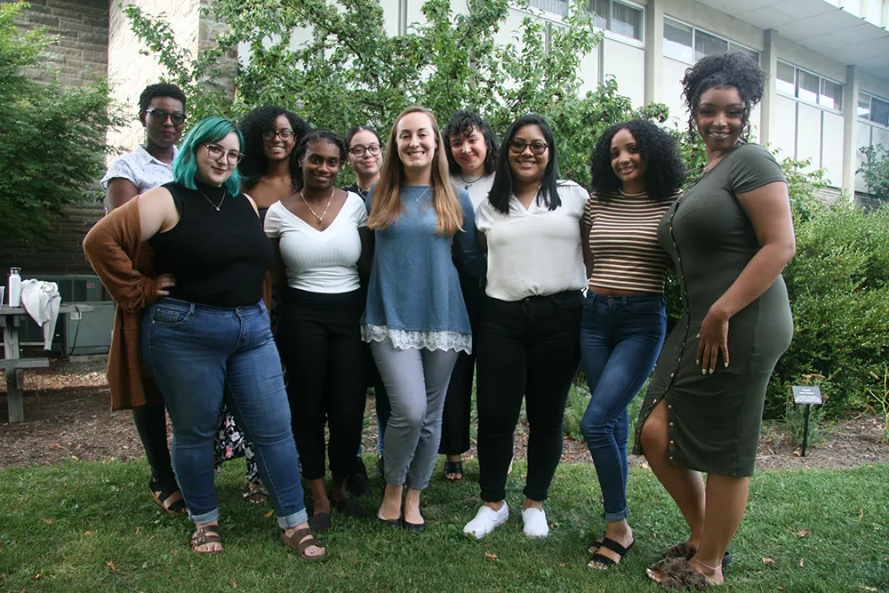 A group of women posing outside