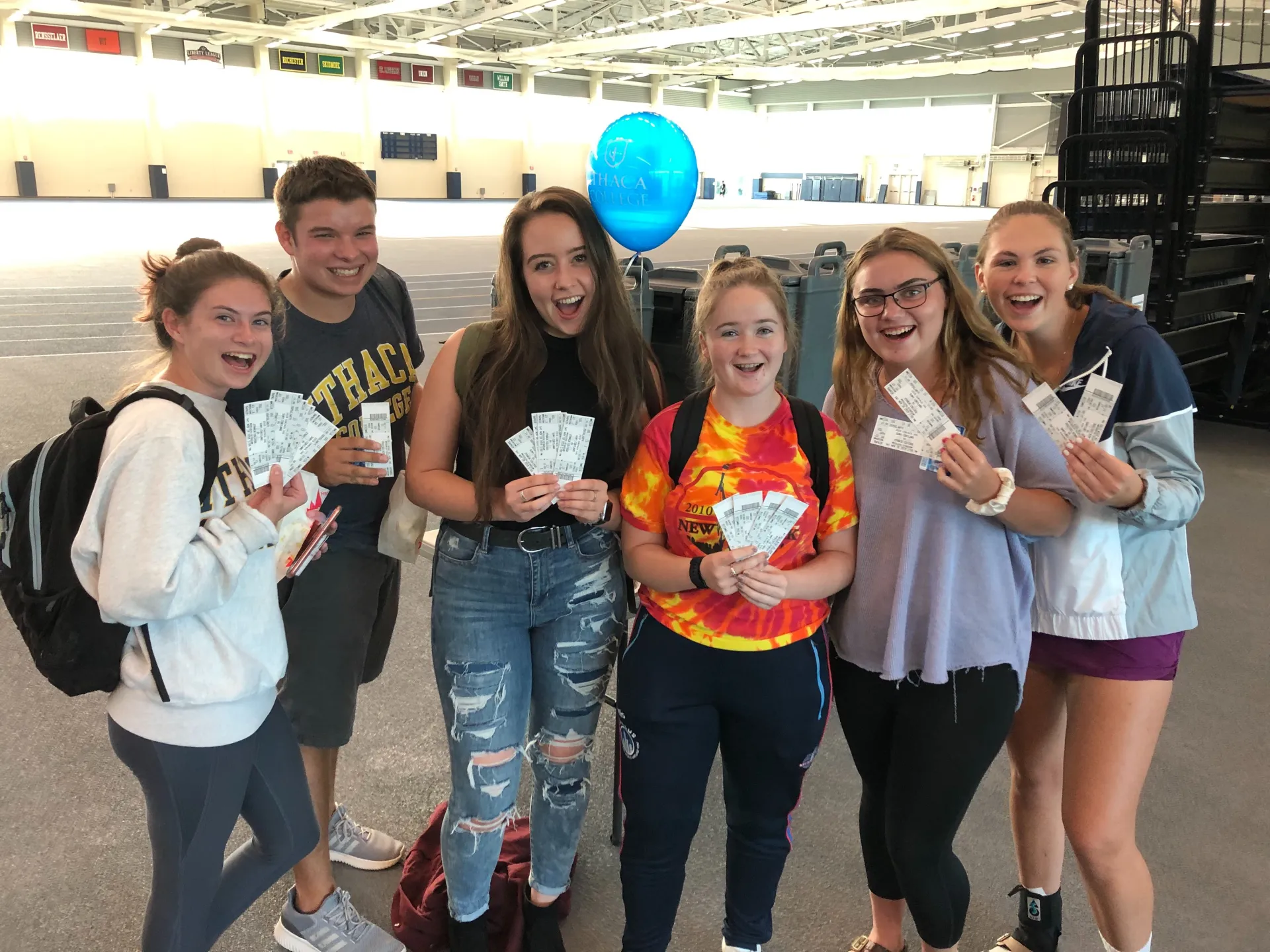 Students holding tickets