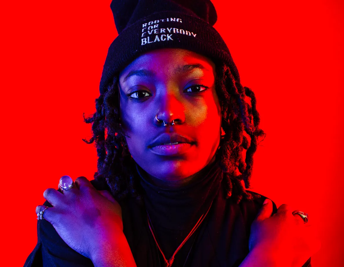 artistic photo of a woman against a red background
