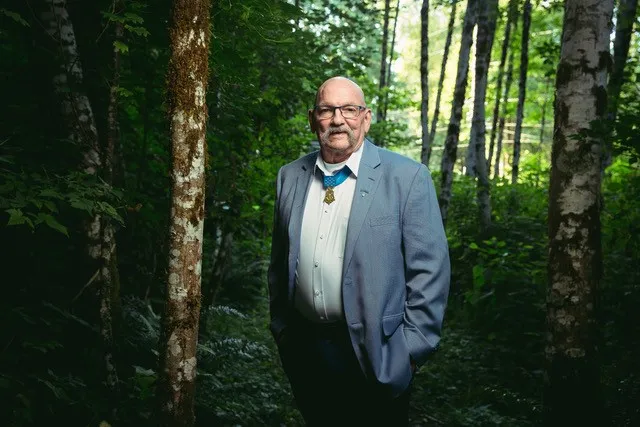 A man standing in the woods
