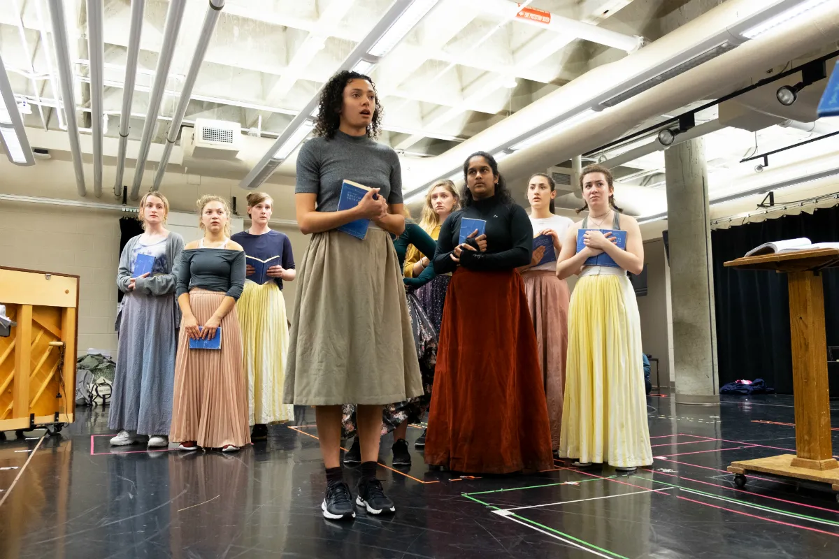 A group of women holding books