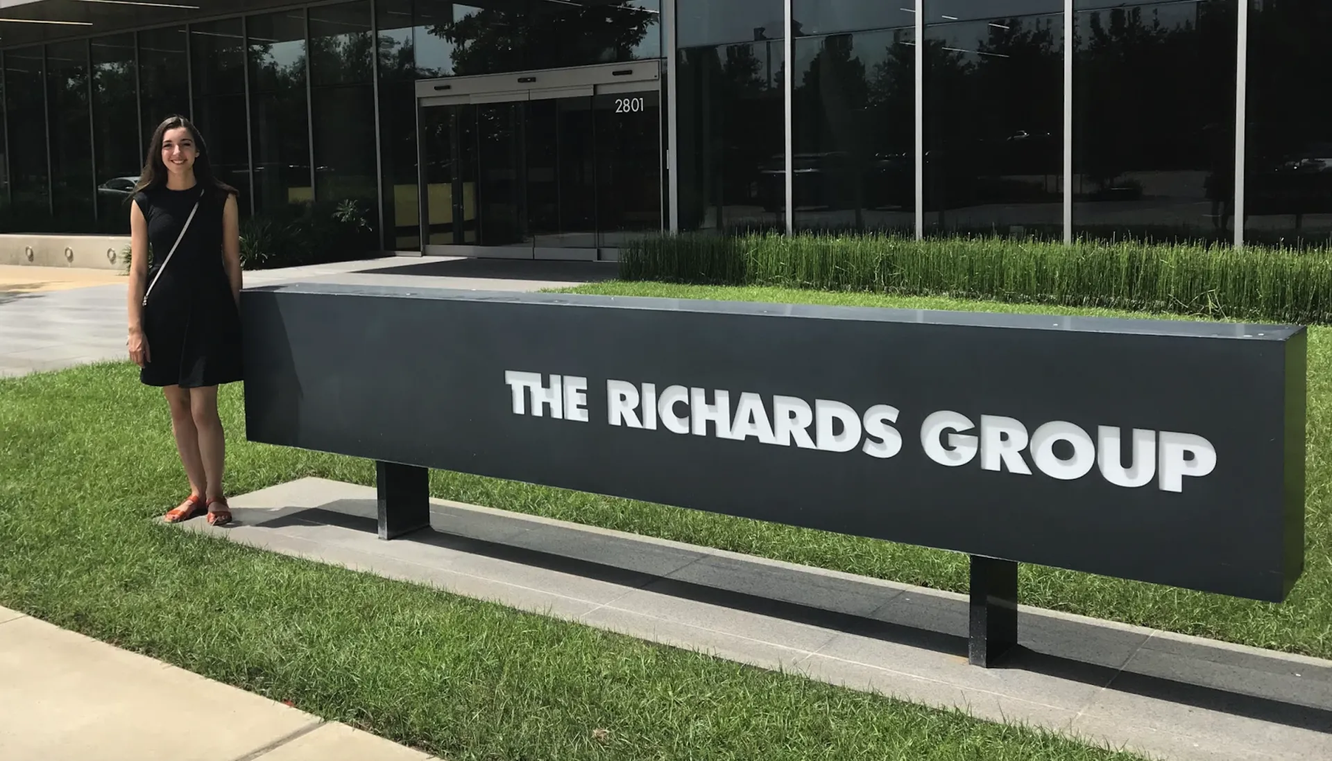 A young woman standing outside a building
