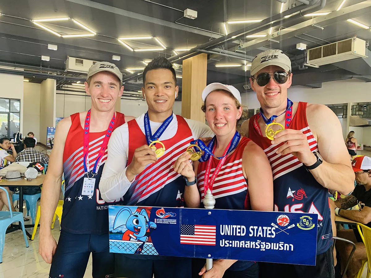 Four rowers with medals
