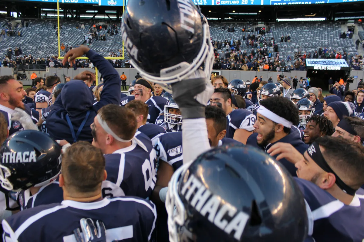 Football players celebrating in a group