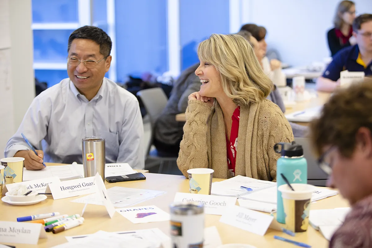 faculty members sitting at a table together