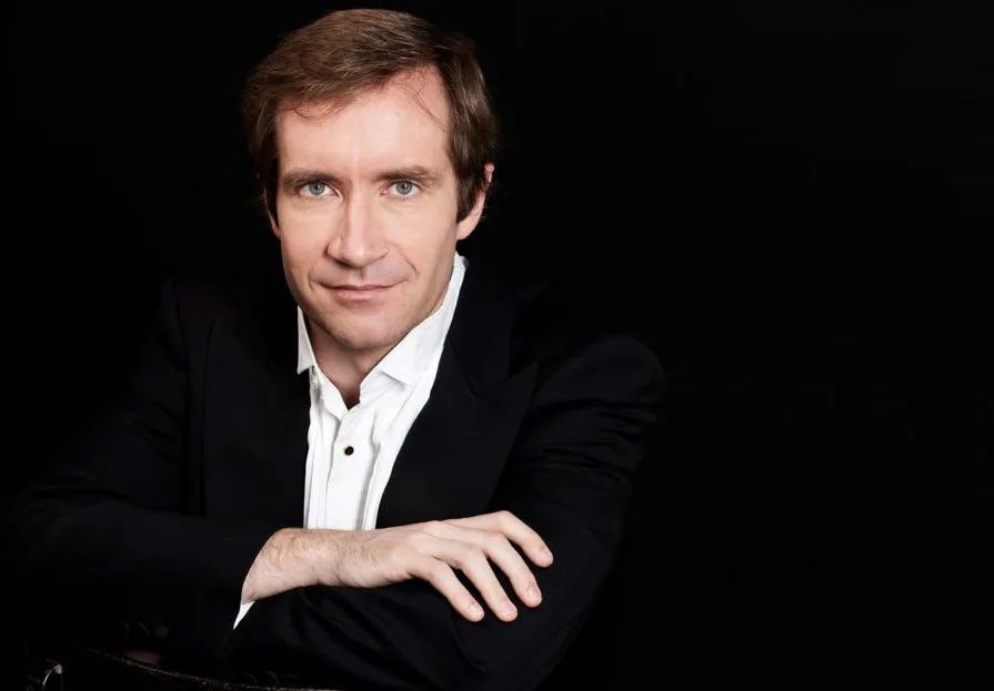 man with arms folded