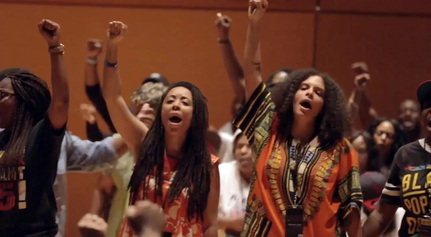 women raising their fists in the air