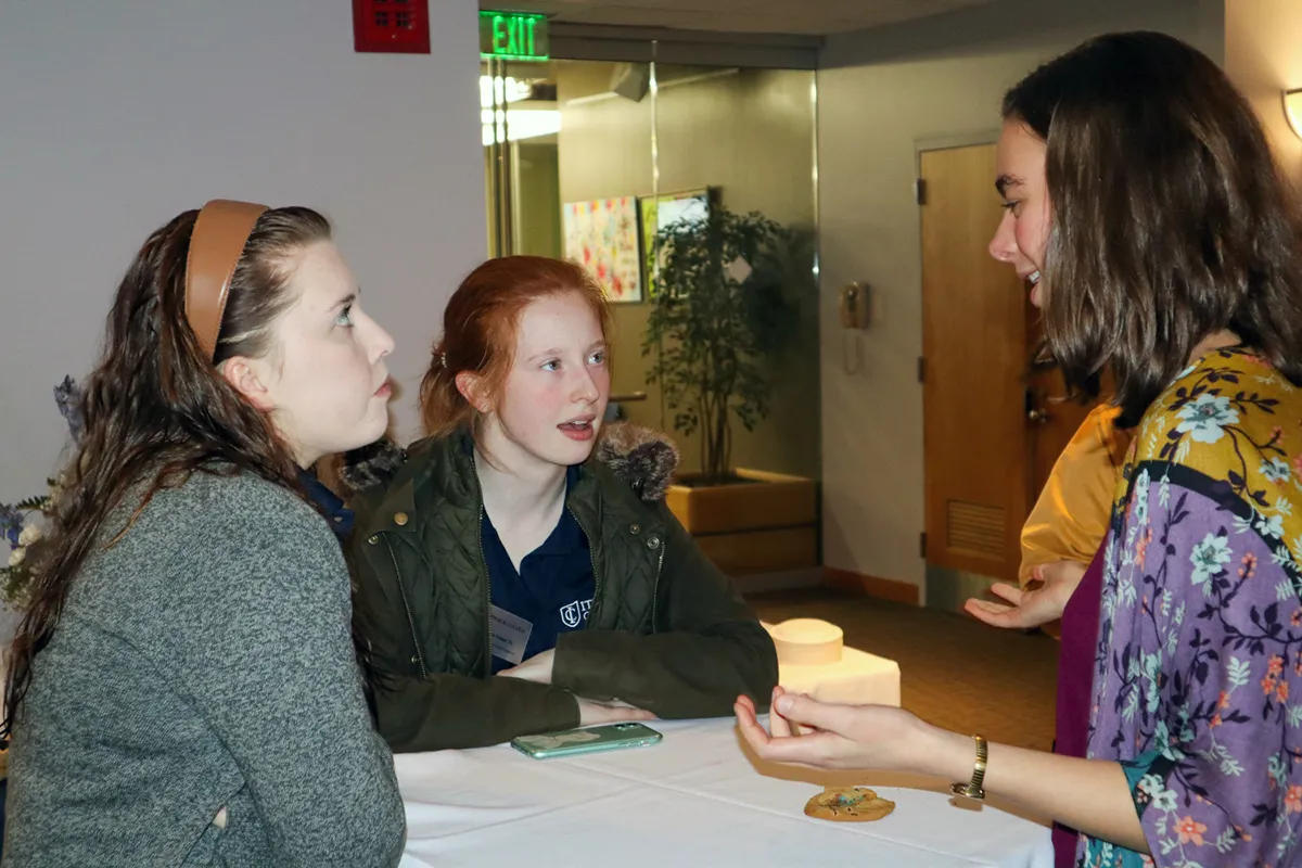 Imogen Mills talking with attendees