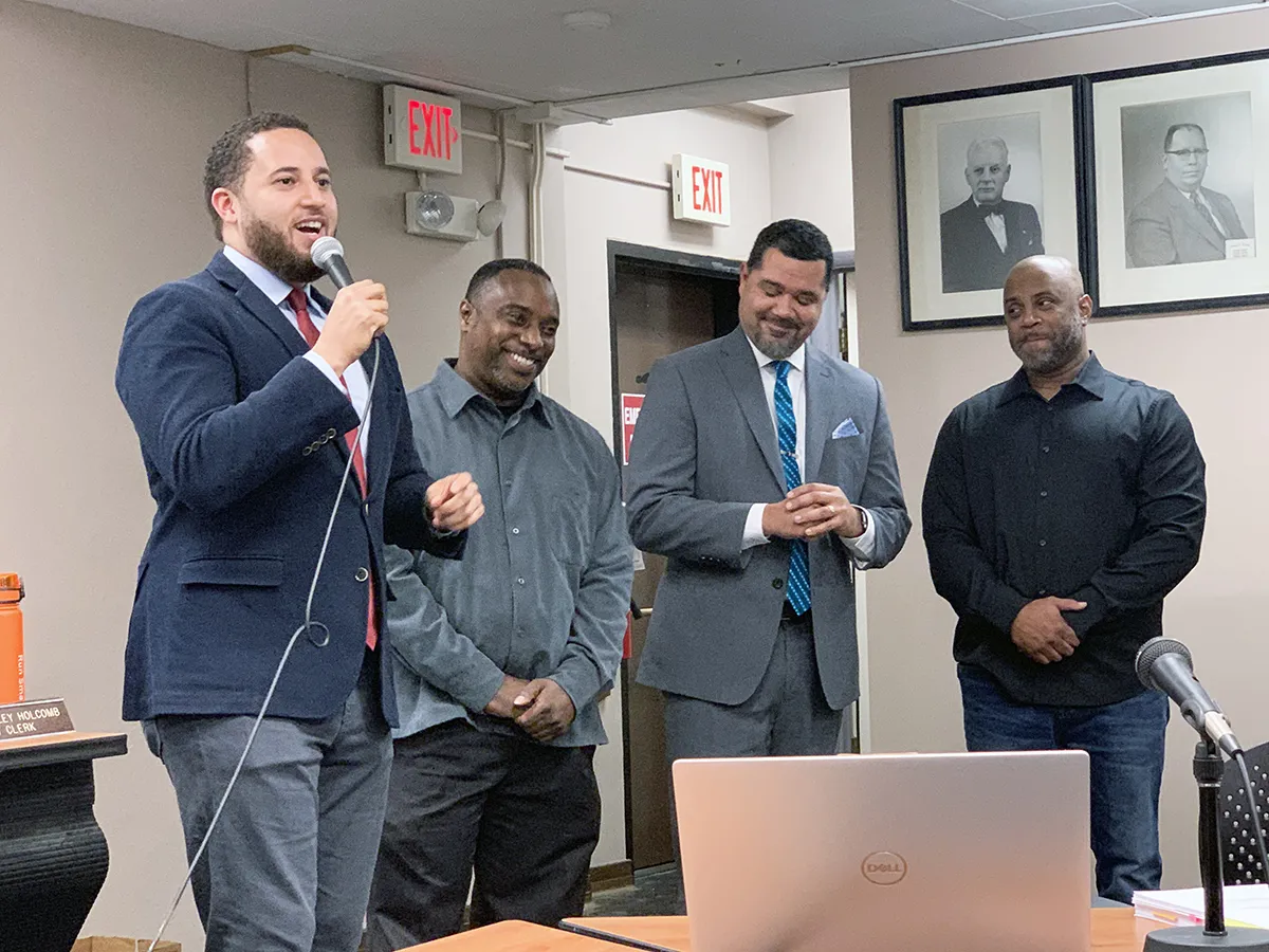 man being given award