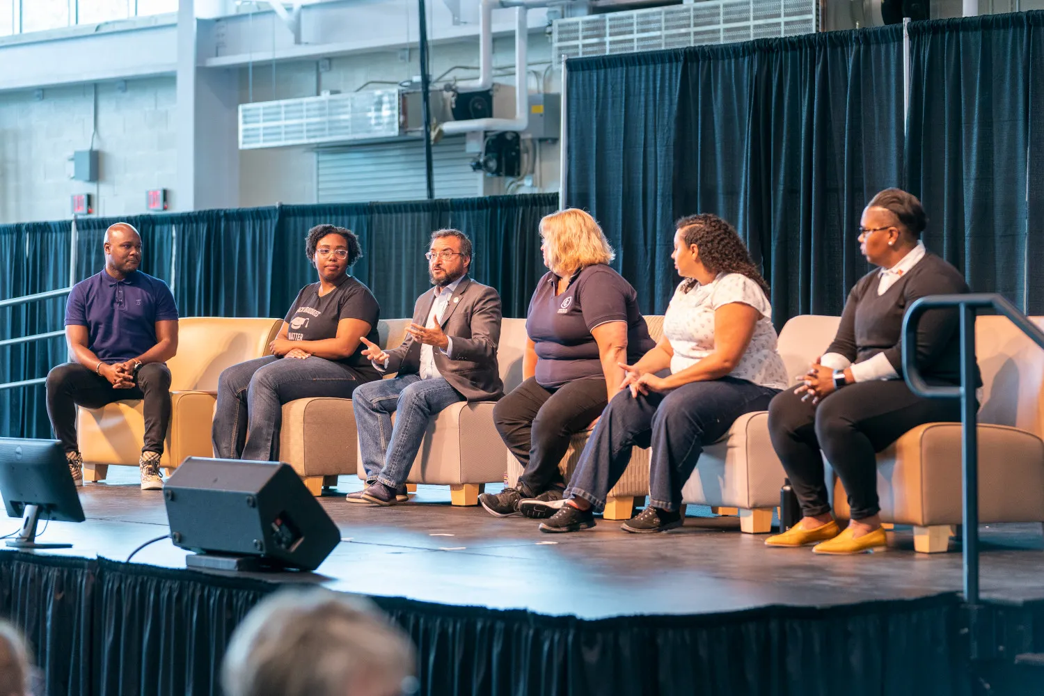 We Are IC panelists on stage for moderated discussion