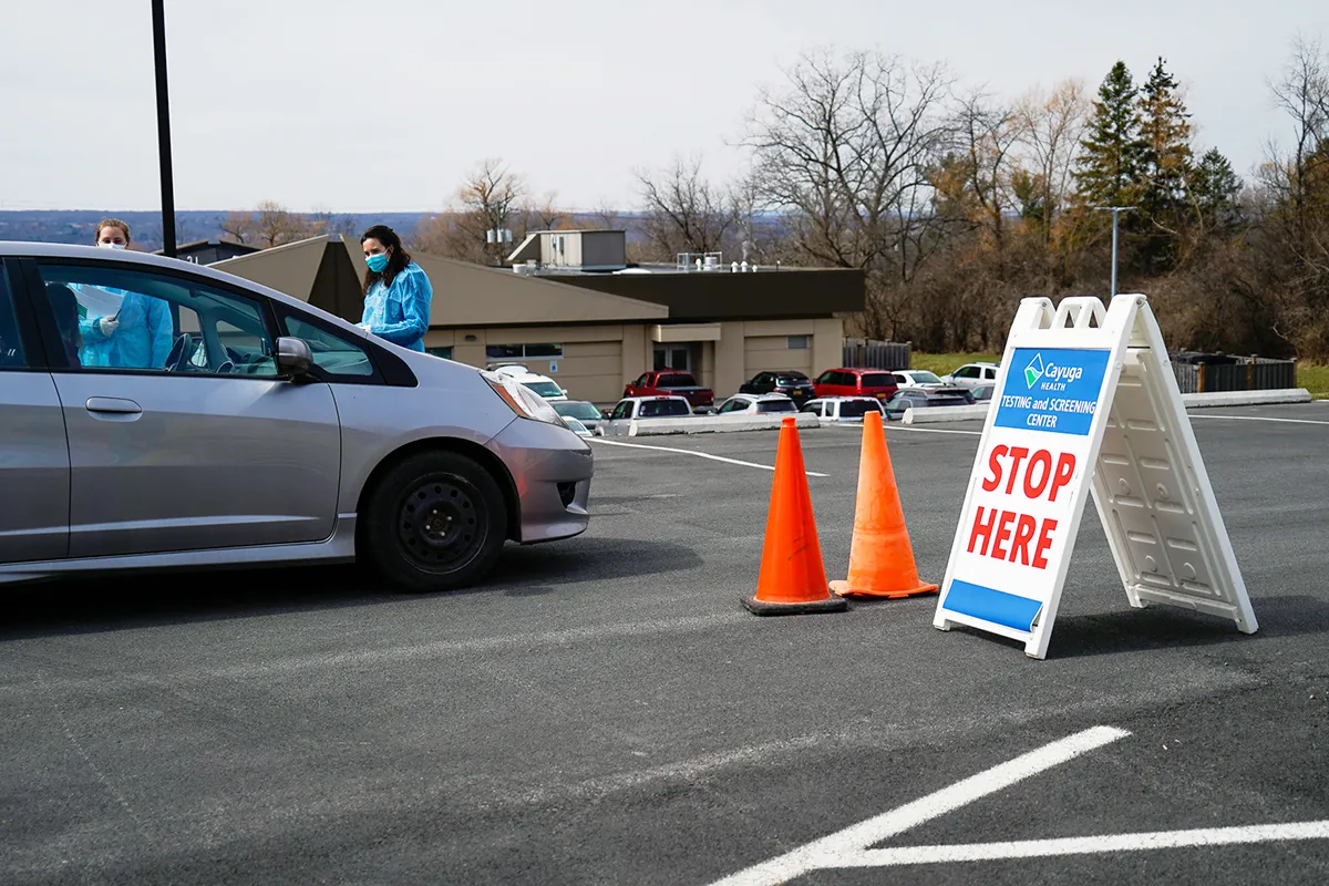 worker talking to driver at test site