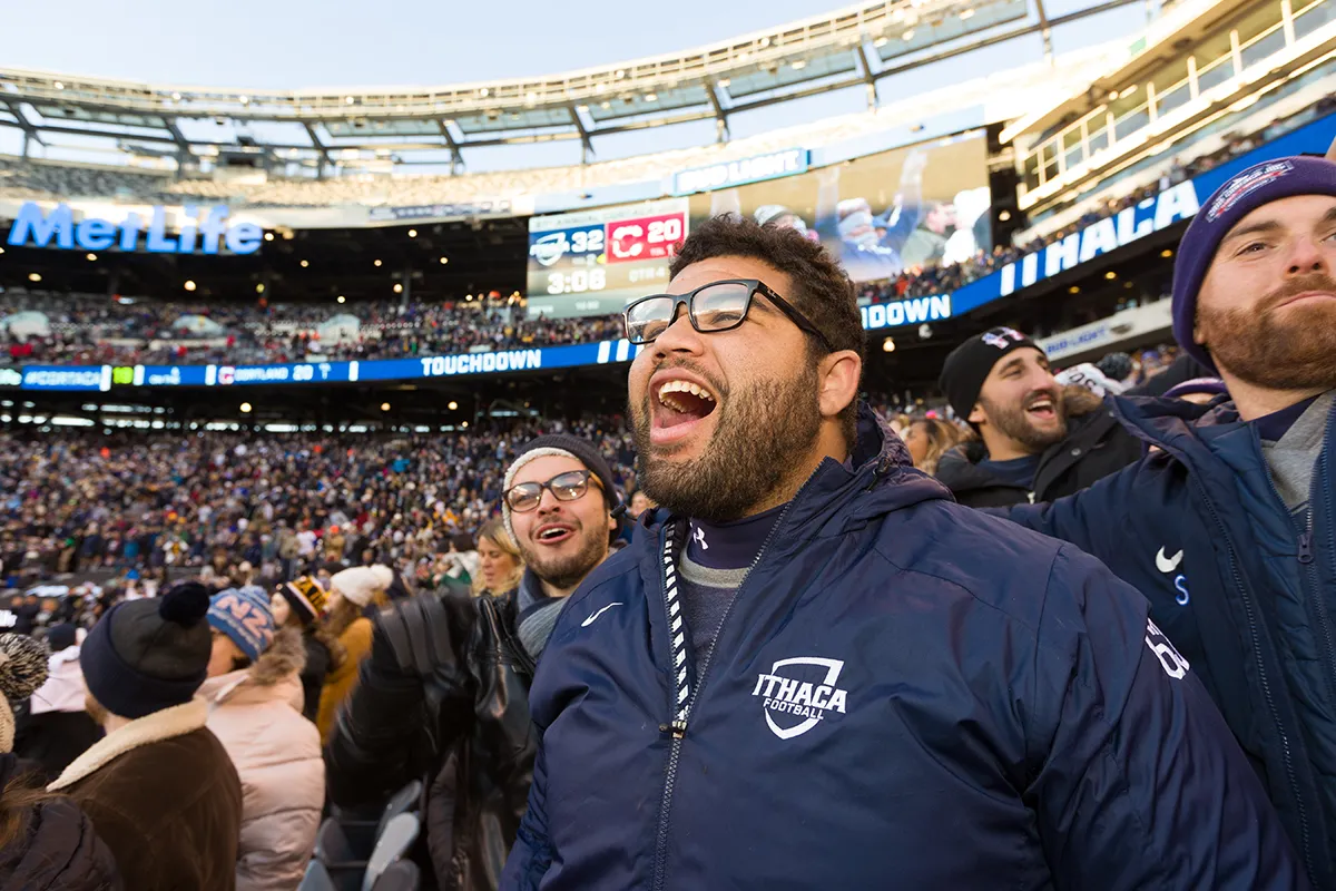 fans cheering at a football game