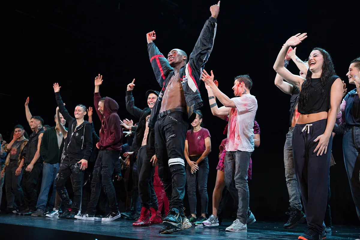 man in curtain call after theatre performance