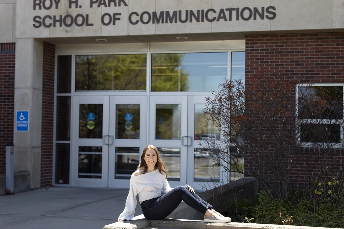 woman outside a campus building