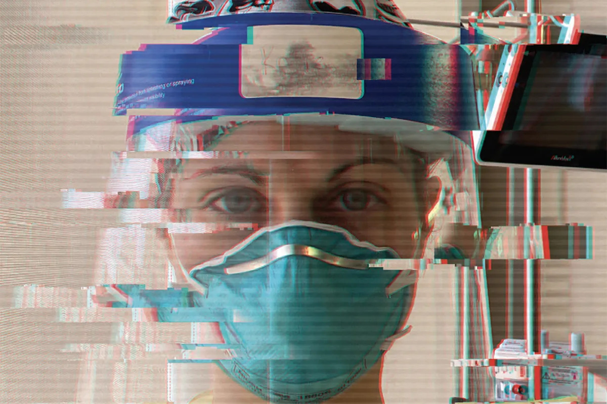 nurse in mask and face shield