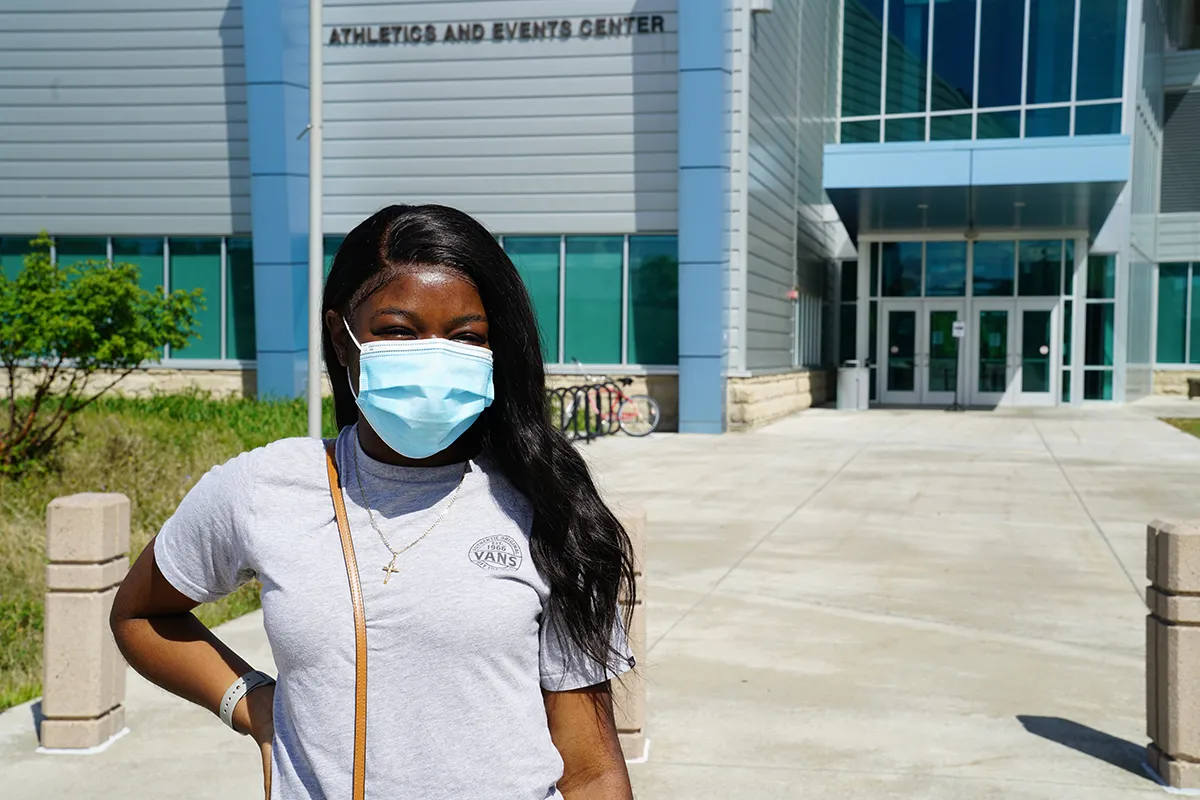 student wearing a mask on campus