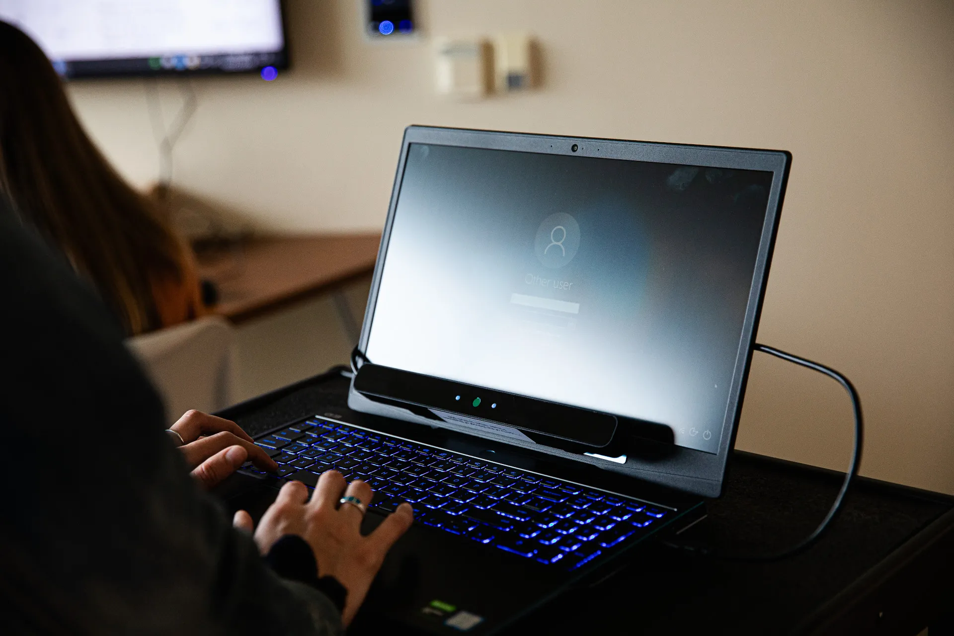 A person typing on a computer
