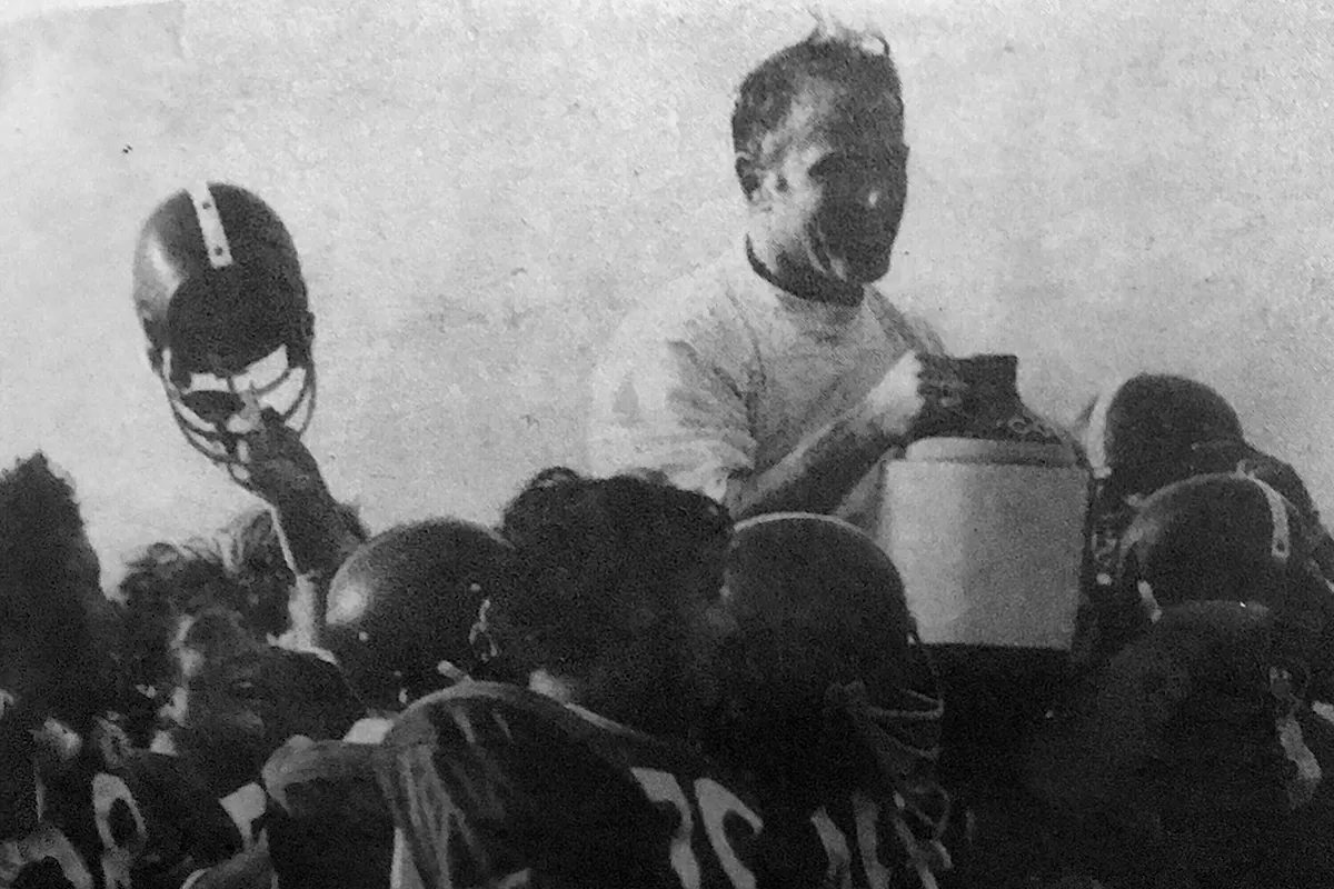 coach holding Cortaca jug