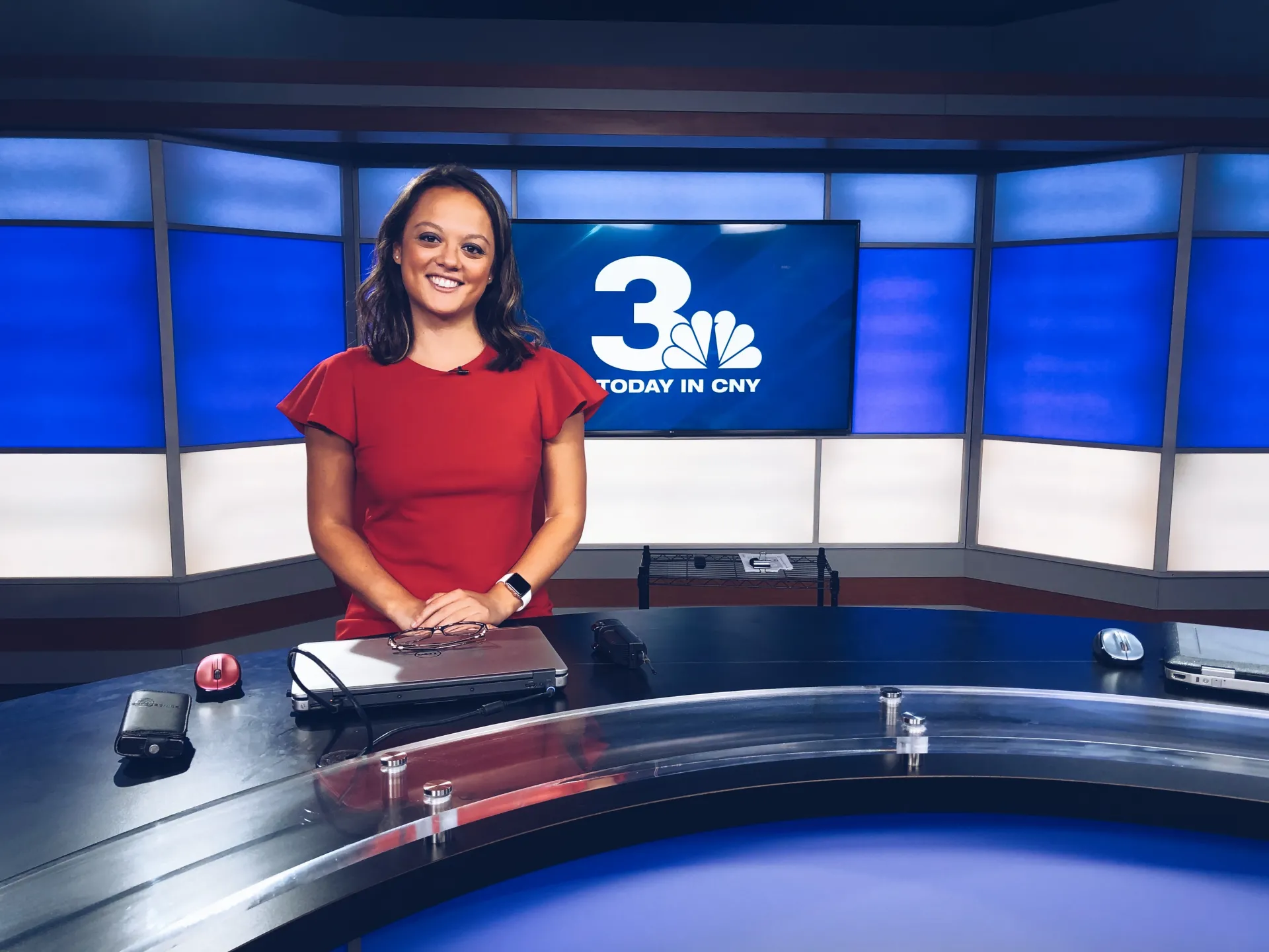 Journalist Amanda Chin sitting at news desk