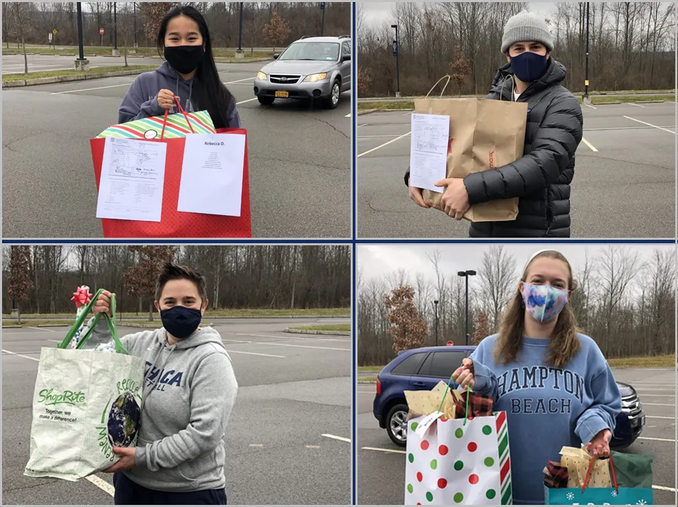 Student athletes and coaches holding gift bags