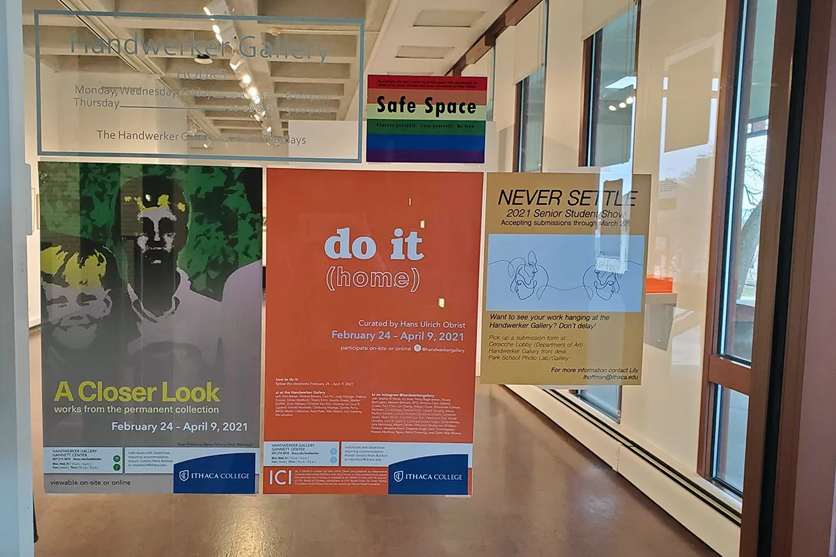 gallery window with posters for exhibits