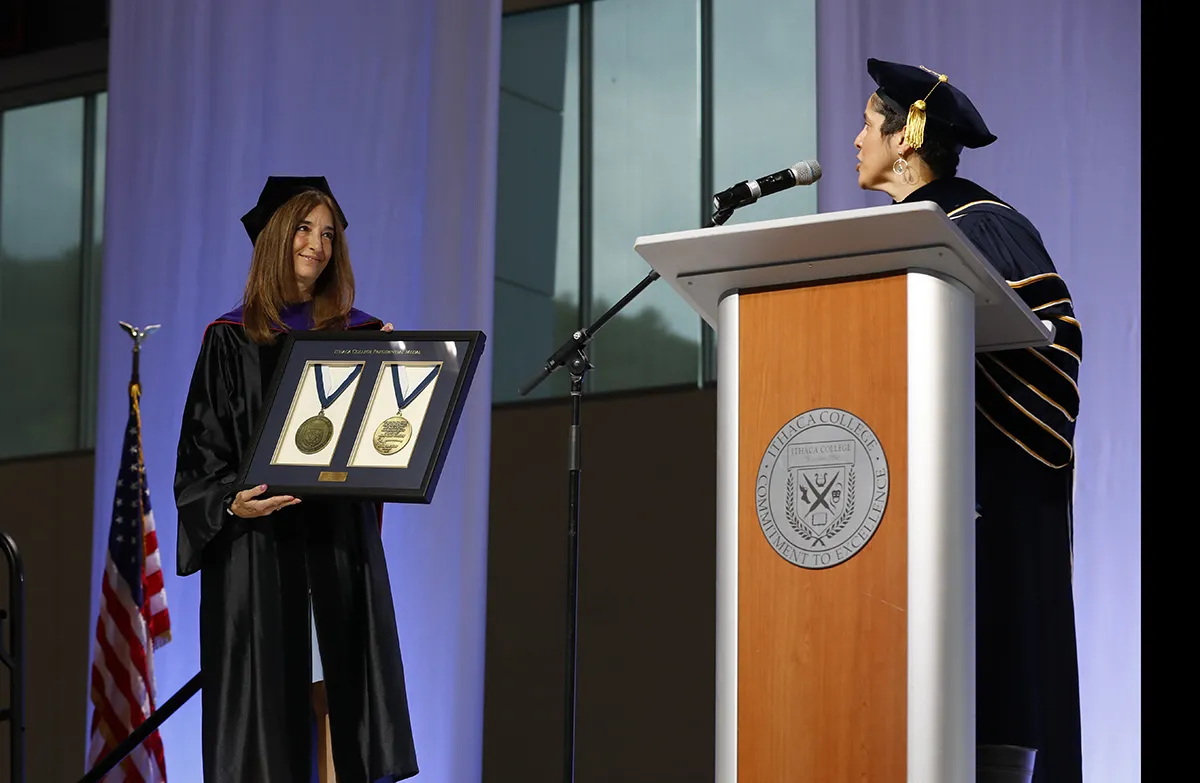 Eileen Filler-Corn is presented with the presidential medal