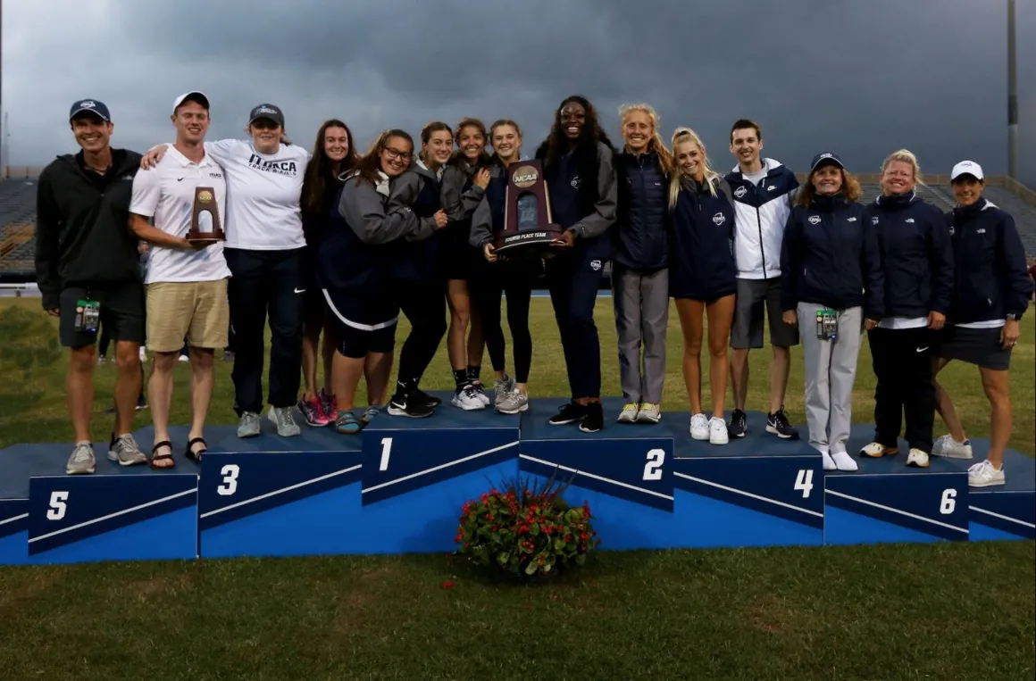 Members of track team on podium