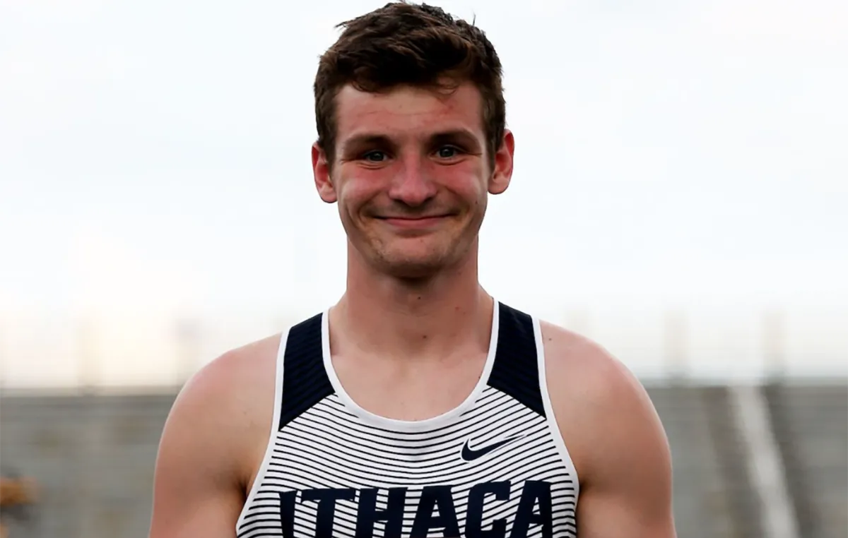 Dom Mikula holding a trophy