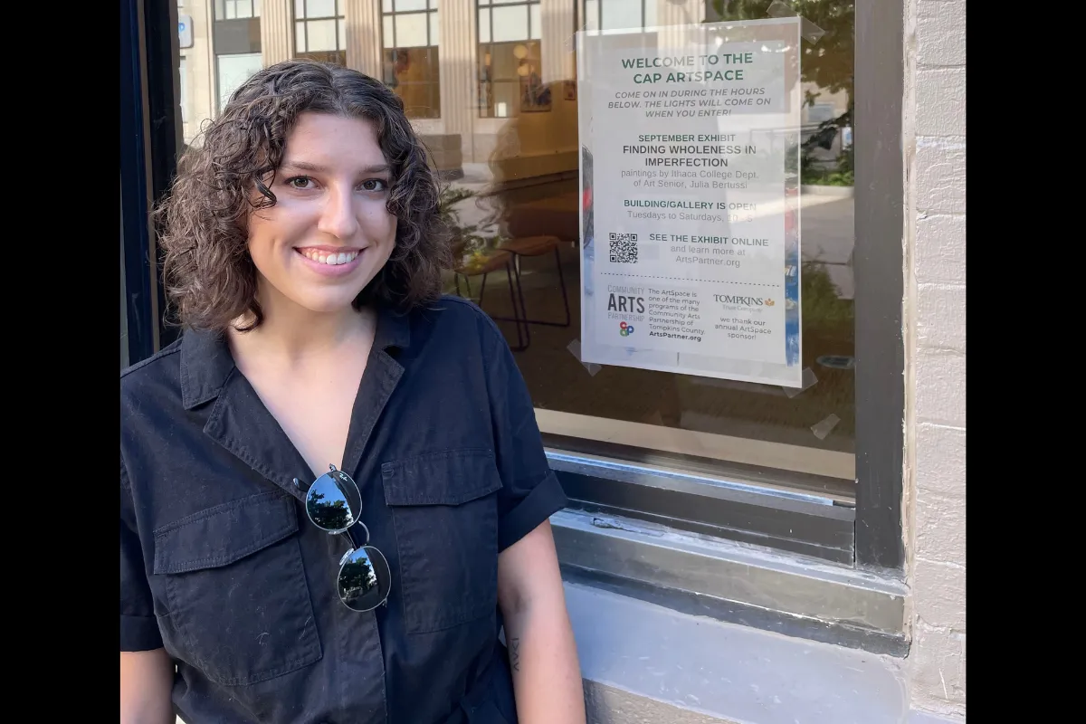 Julia Bertussi ’22 standing outside the Community ArtSpace