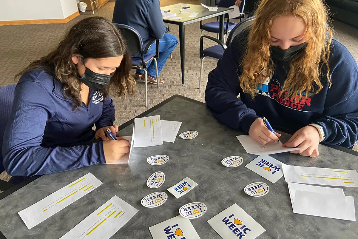 Students writing thank you notes