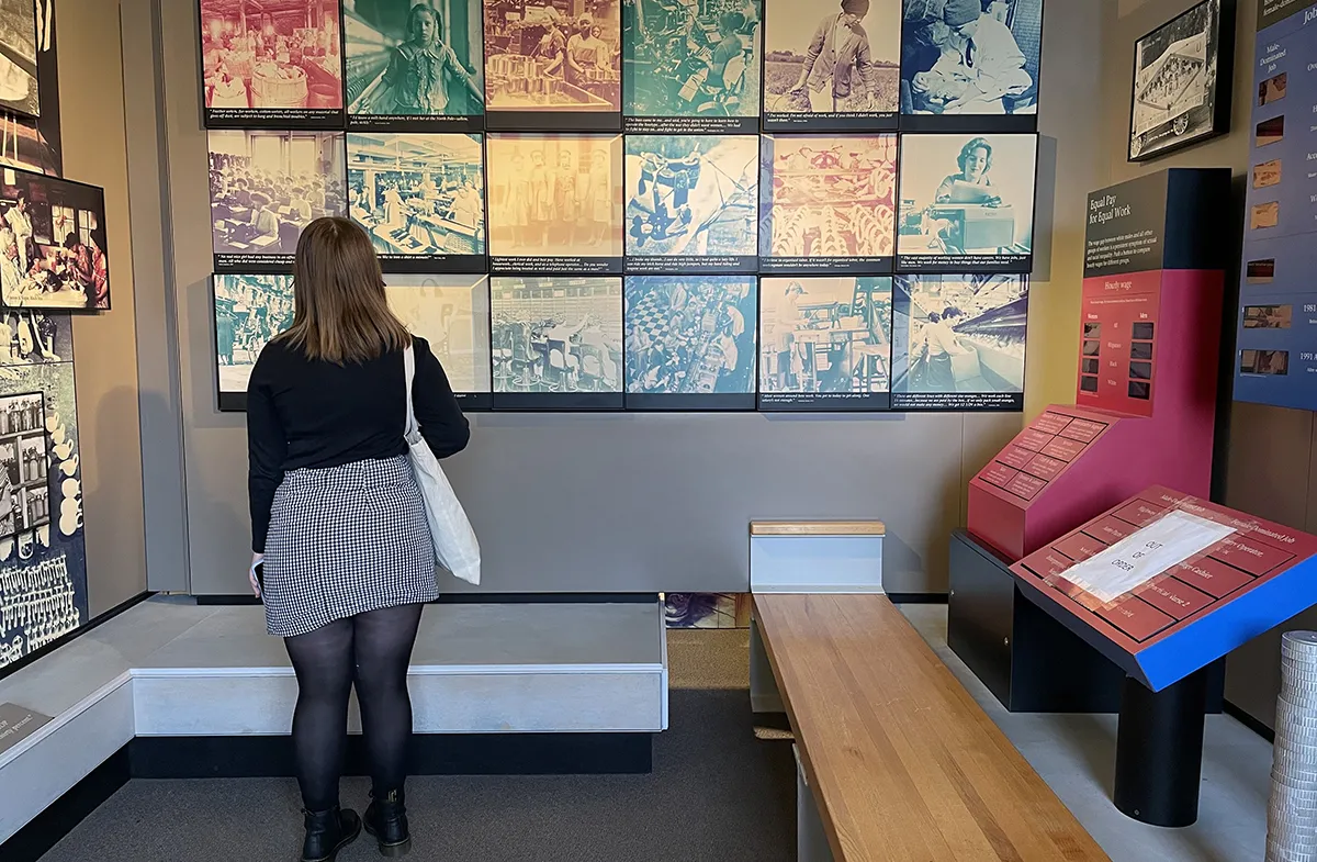 Woman standing in front of a museum display