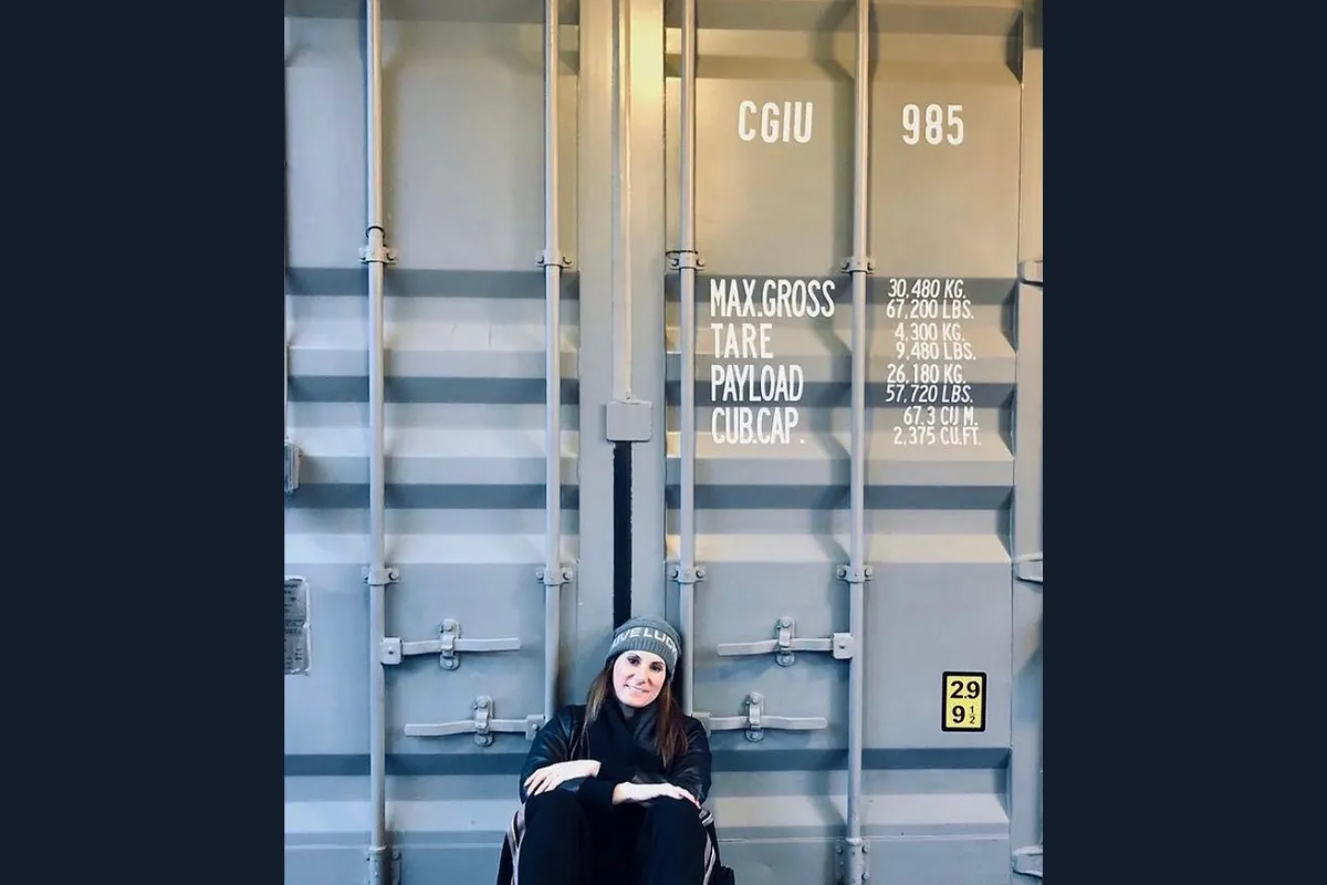 Rory Rubin in front of a shipping container