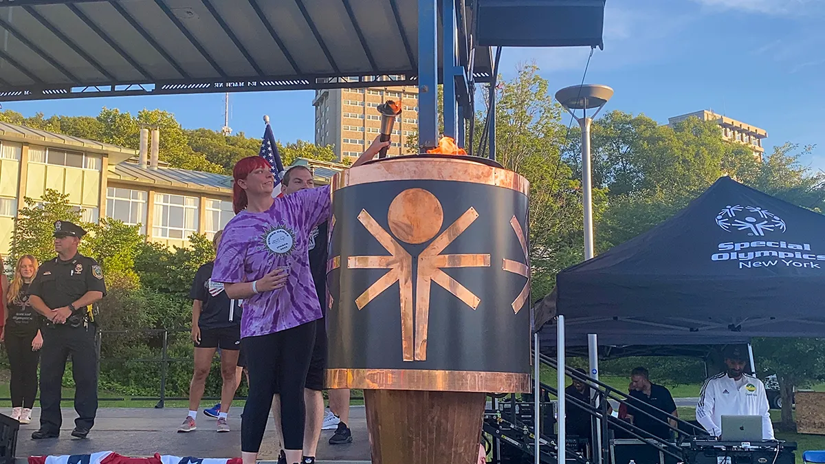 Special Olympic Athletes lighting the torch