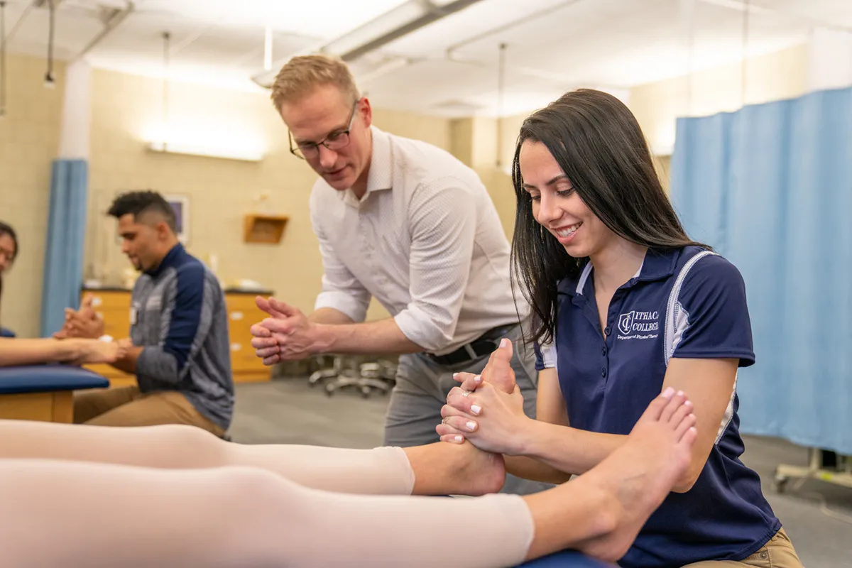 A student providing treatment to an ankle