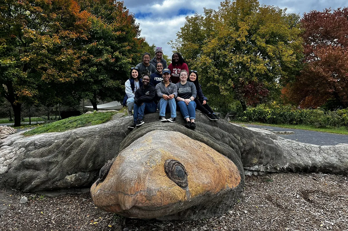 Students sitting on a turtle