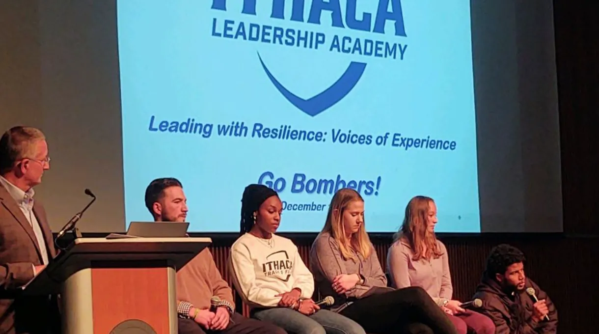 Students sitting on stage