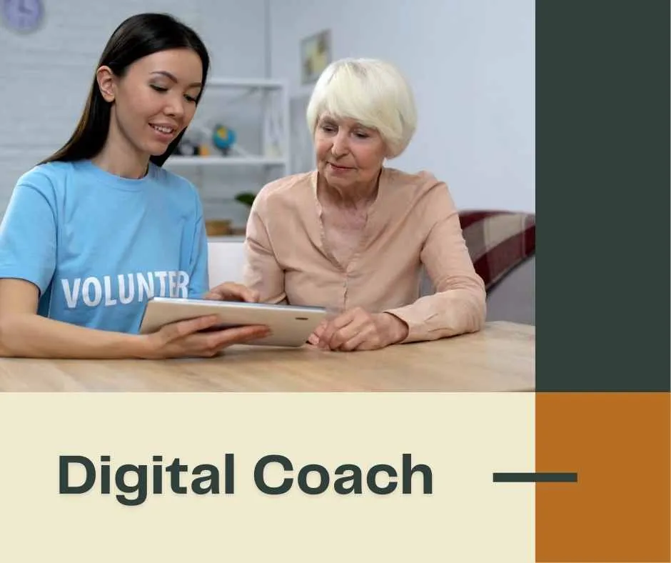 volunteer meeting with older woman using a tablet