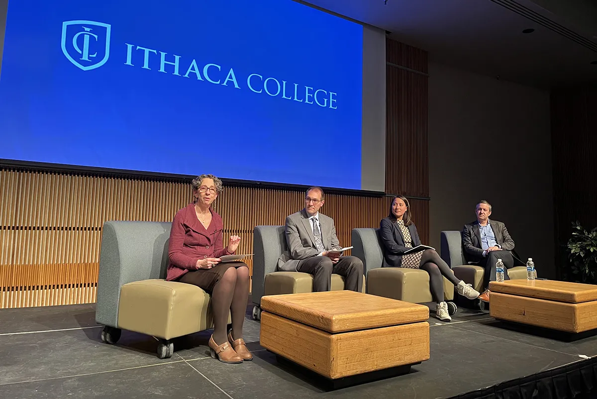 The panelists on a stage