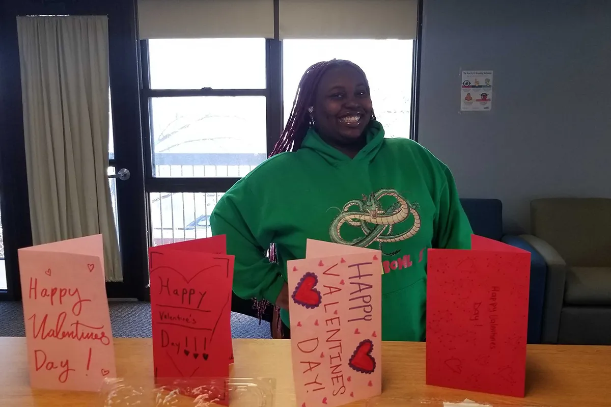 Student in front of cards
