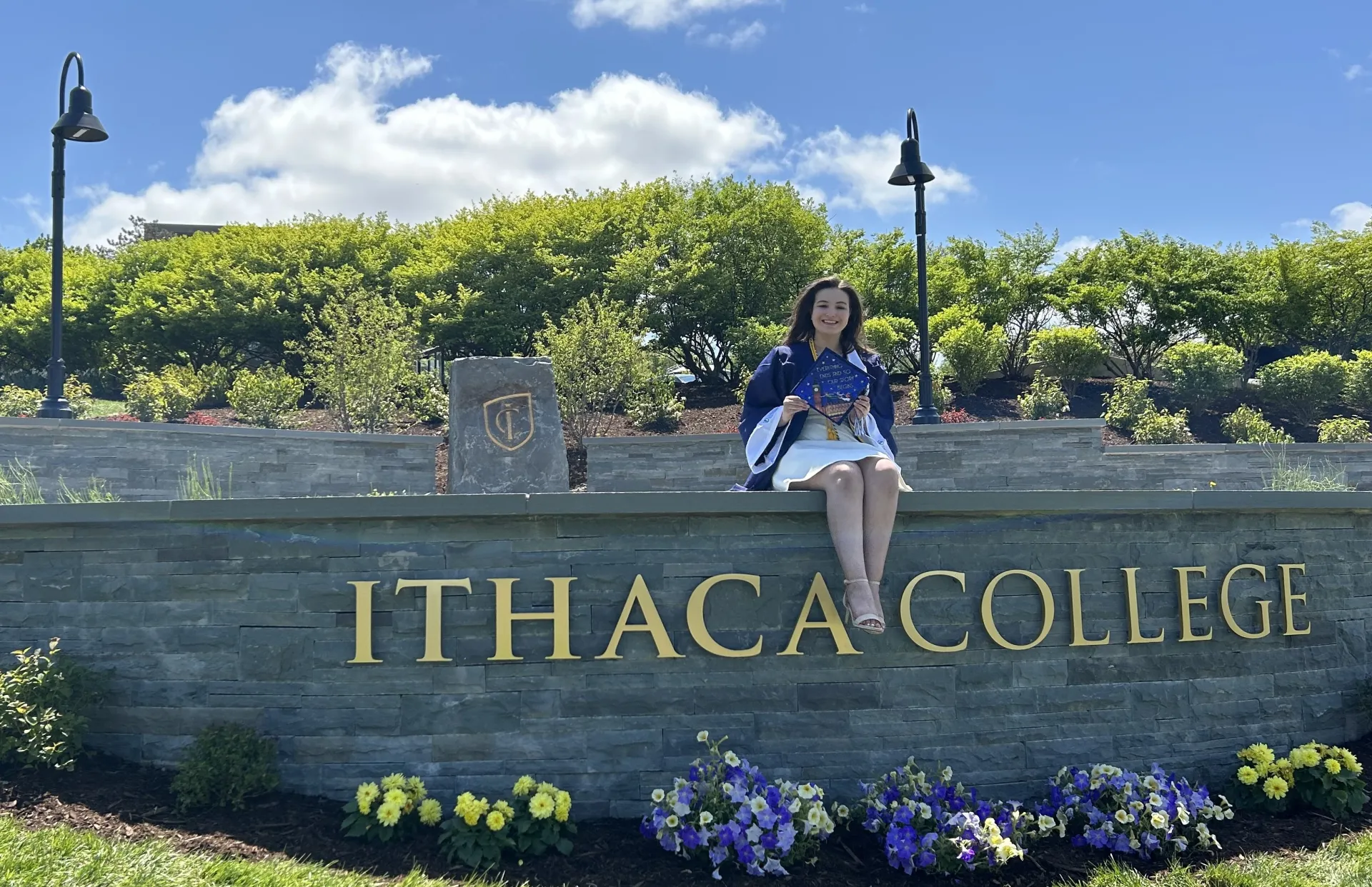 woman sitting on a wall