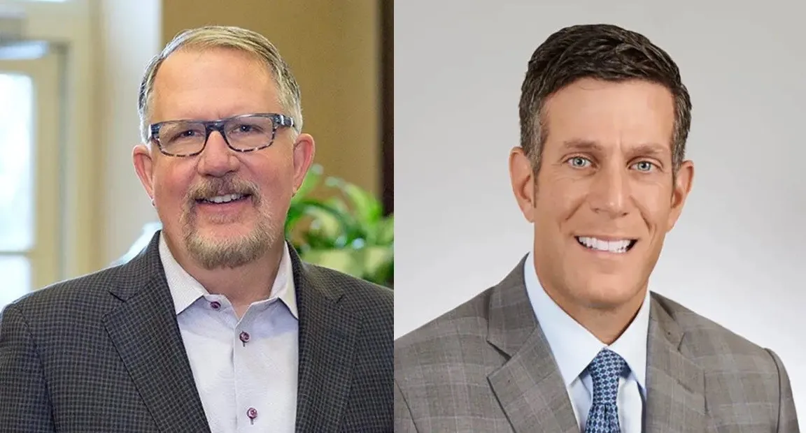 man in glasses and man wearing tie