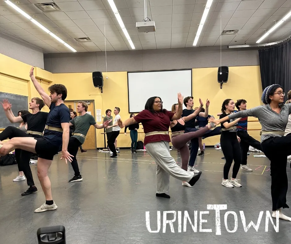 students kicking out their legs and swinging their arms